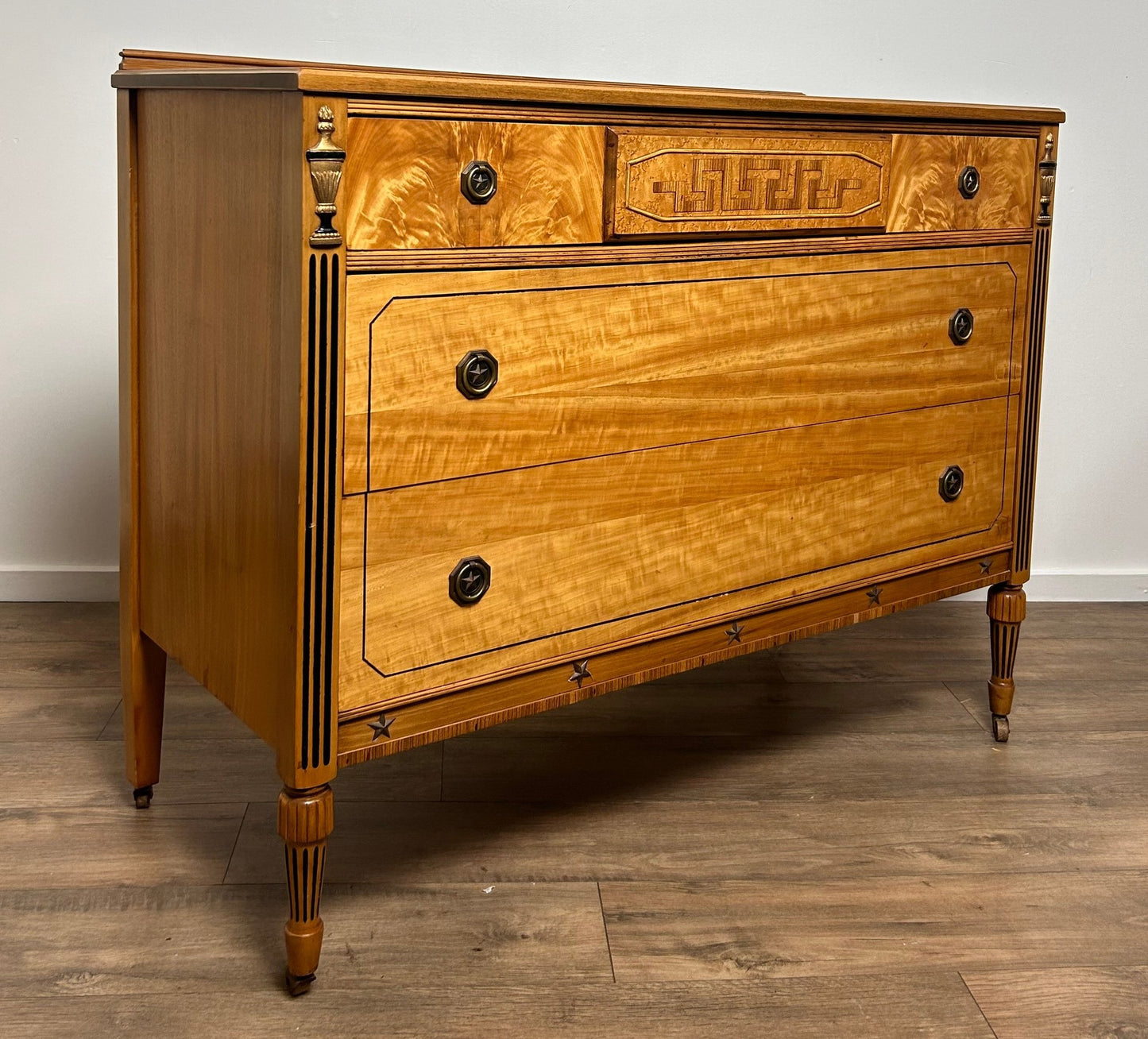 Neoclassical Style Inlaid Flame Birch Dresser – Antique Empire Chest with Star and Urn Carvings